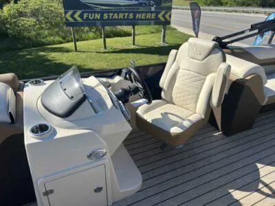 Slide: The Image of 2025 Lowe SS 250 Walk Thru boat interior with steering console and seating. - 5