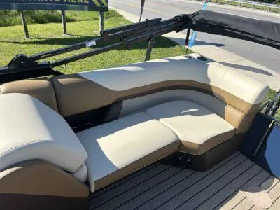 Slide: The Image of 2025 Lowe SS 250 Walk Thru boat with beige and brown seating on deck. - 8