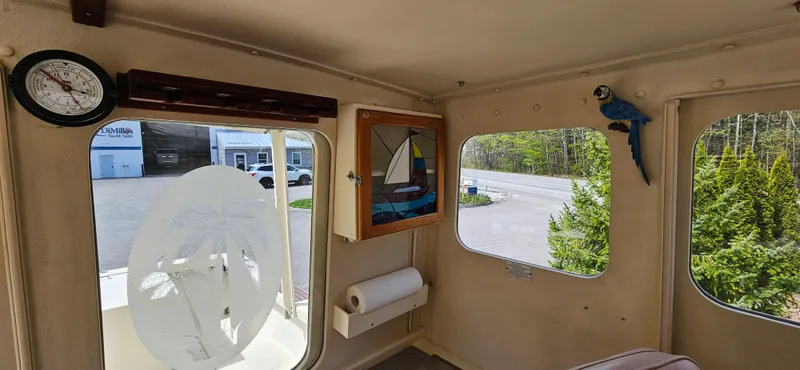 Slide: The Image of Interior of 2001 Rosborough RF-246 Custom Wheelhouse with nautical decor and large windows. - 11