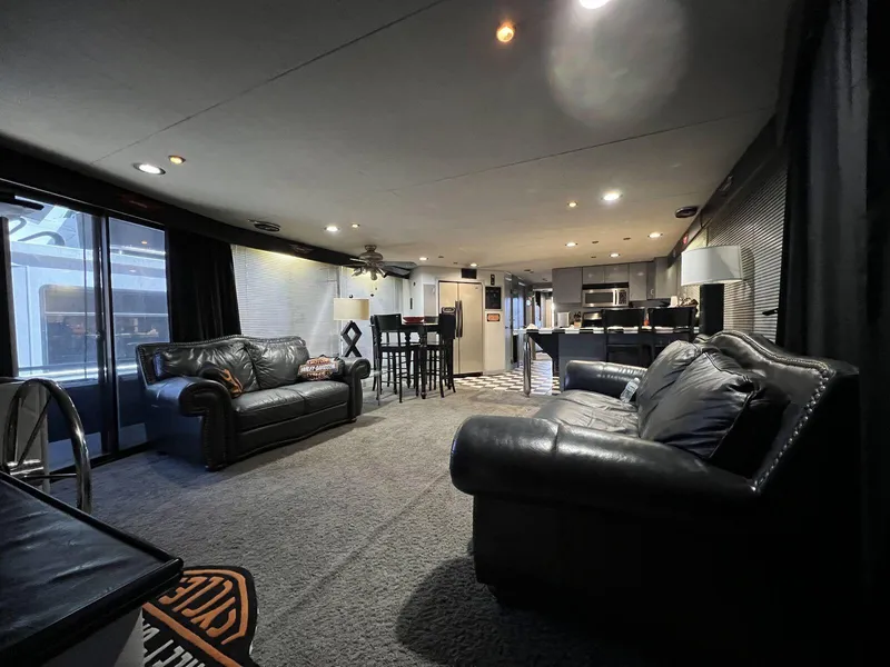 Slide: The Image of Luxurious interior of a 1996 Skipperliner 61x16 houseboat with leather sofas and modern decor. - 5