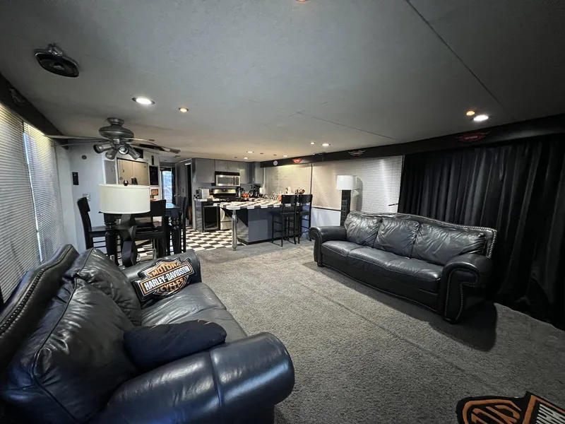 Slide: The Image of Luxurious interior of a 1996 Skipperliner 61x16 houseboat with modern furnishings and kitchen. - 7