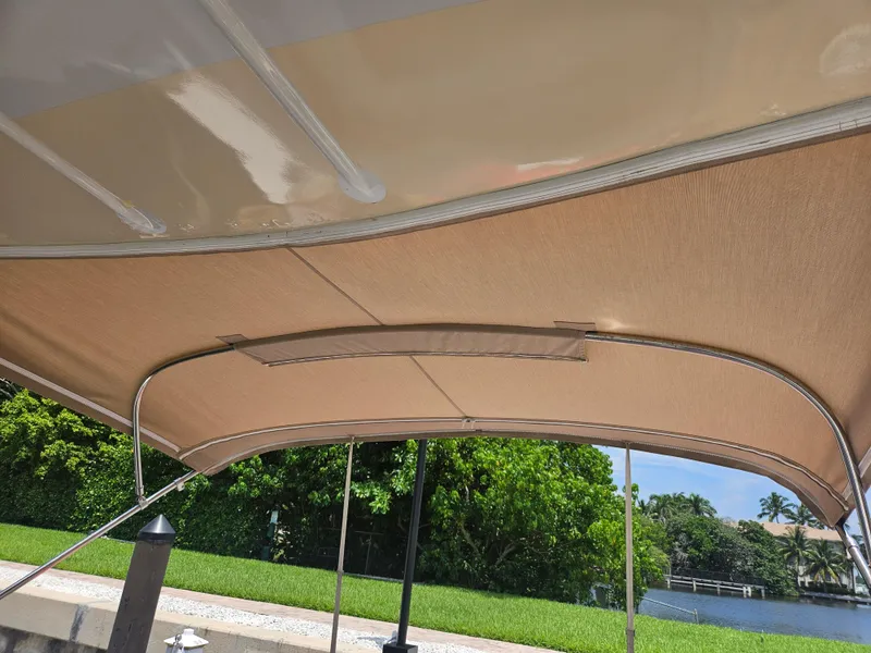 Slide: The Image of 2005 Four Winns 378 Vista boat canopy with scenic waterfront view. - 14