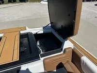 Slide: The Image of 2025 ATX Surf Boats 24 Type-S storage compartment with open lid, showcasing interior space. - 11