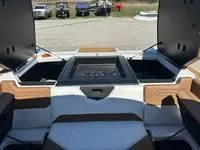Slide: The Image of 2025 ATX Surf Boats 24 Type-S interior with open storage compartments. - 12