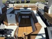 Slide: The Image of 2025 ATX Surf Boats 24 Type-S interior with brown and white seating. - 15