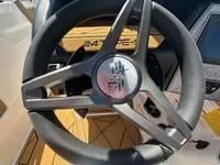 Slide: The Image of Steering wheel of 2025 ATX Surf Boats 24 Type-S, featuring sleek design and modern controls. - 18