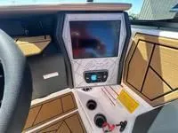 Slide: The Image of 2025 ATX Surf Boats 24 Type-S dashboard with touchscreen and modern controls. - 19