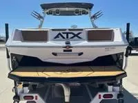 Slide: The Image of 2025 ATX Surf Boats 24 Type-S, rear view, on trailer, sunny day. - 3