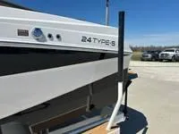 Slide: The Image of 2025 ATX Surf Boats 24 Type-S, sleek design, parked outdoors. - 4