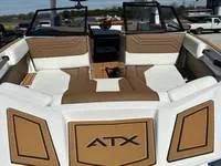Slide: The Image of 2025 ATX Surf Boats 24 Type-S interior with tan and white seating. - 6