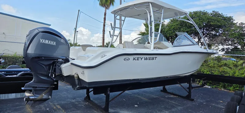 Slide: The Image of 2024 Key West 239 DFS boat with Yamaha outboard engine on display. - 1
