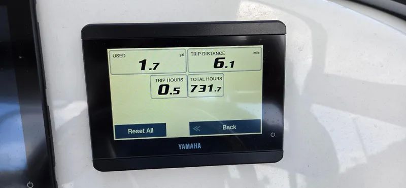 Slide: The Image of Yamaha display showing trip data on a 2024 Key West 239 DFS boat. - 14