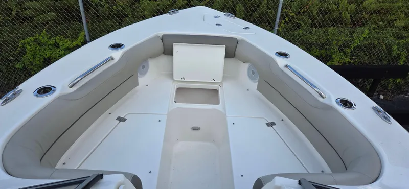 Slide: The Image of 2024 Key West 239 DFS boat interior with spacious seating and storage compartments. - 15