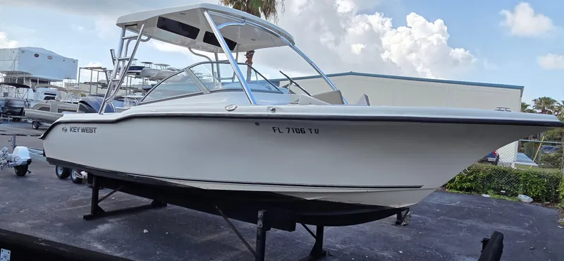 Slide: The Image of 2024 Key West 239 DFS boat on display, featuring sleek design and modern structure. - 2