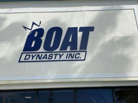 Slide: The Image of Boat Dynasty Inc. sign on building exterior, featuring Key West 239 DFS, 2024 model. - 21