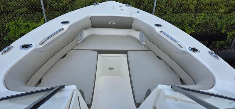 Slide: The Image of 2024 Key West 239 DFS boat interior with cushioned seating and sleek design. - 5
