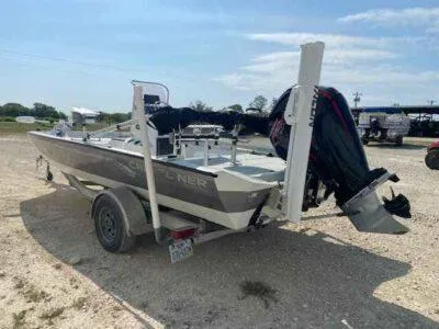 Slide: The Image of 2019 Crestliner 2000 Bay boat on trailer, parked outdoors under clear sky. - 3