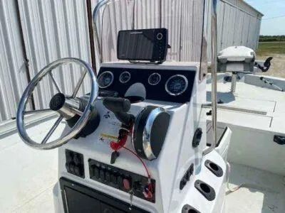 Slide: The Image of 2019 Crestliner 2000 Bay boat console with steering wheel and navigation equipment. - 7