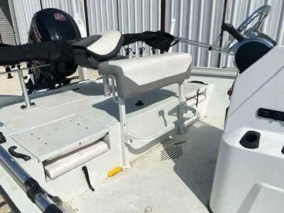 Slide: The Image of 2019 Crestliner 2000 Bay boat interior with steering wheel and seating. - 8