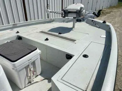 Slide: The Image of 2019 Crestliner 2000 Bay boat interior with storage compartments and seating. - 9