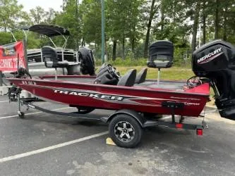 The Image of 2020 Tracker Pro Team 175 TXW TE fishing boat with Mercury engine, parked outdoors. - 0