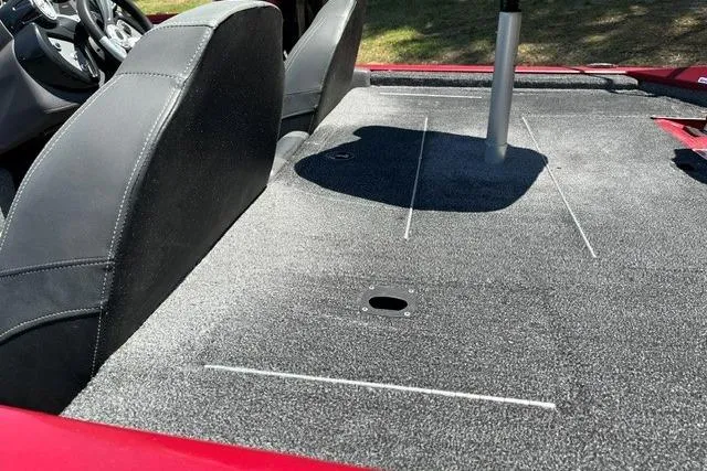 Slide: The Image of The image shows the gray carpeted deck of a 2020 Tracker Pro Team 175 TXW TE with black seats. - 11