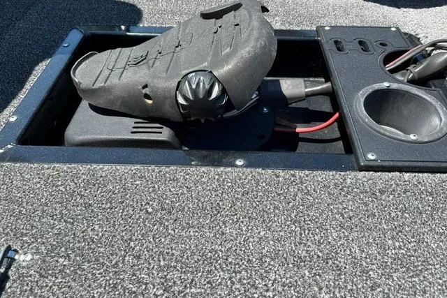 Slide: The Image of Close-up of a boat deck featuring a pedal and cup holders. - 8