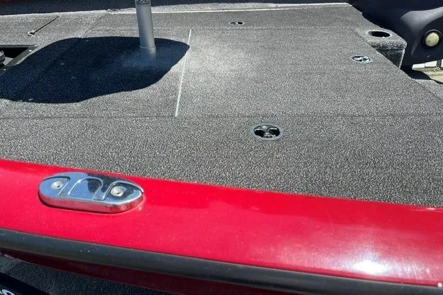 Slide: The Image of Close-up of the deck on a 2020 Tracker Pro Team 175 TXW TE boat with a red edge. - 10