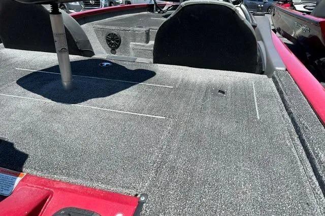 Slide: The Image of The image shows the deck of a 2020 Tracker Pro Team 175 TXW TE boat with gray carpeting. - 5