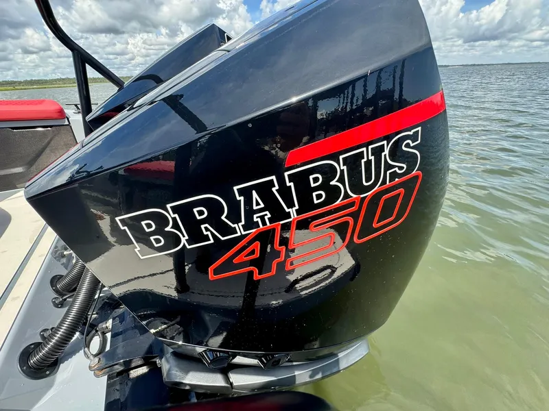 Slide: The Image of Outboard motor of 2023 Axopar Shadow 900XC with Brabus 450 branding on water. - 18