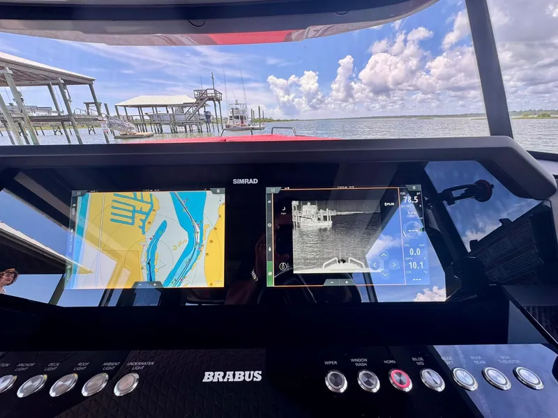 Slide: The Image of 2023 Axopar Shadow 900XC dashboard with navigation screens, dock view, and Brabus controls. - 31