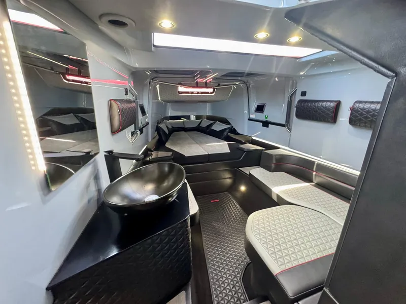 Slide: The Image of Luxurious interior of 2023 Axopar Shadow 900XC boat with modern seating and lighting. - 37
