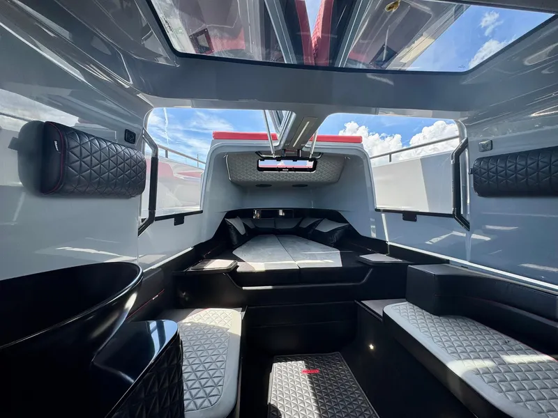 Slide: The Image of 2023 Axopar Shadow 900XC cabin interior with modern design and panoramic windows. - 38