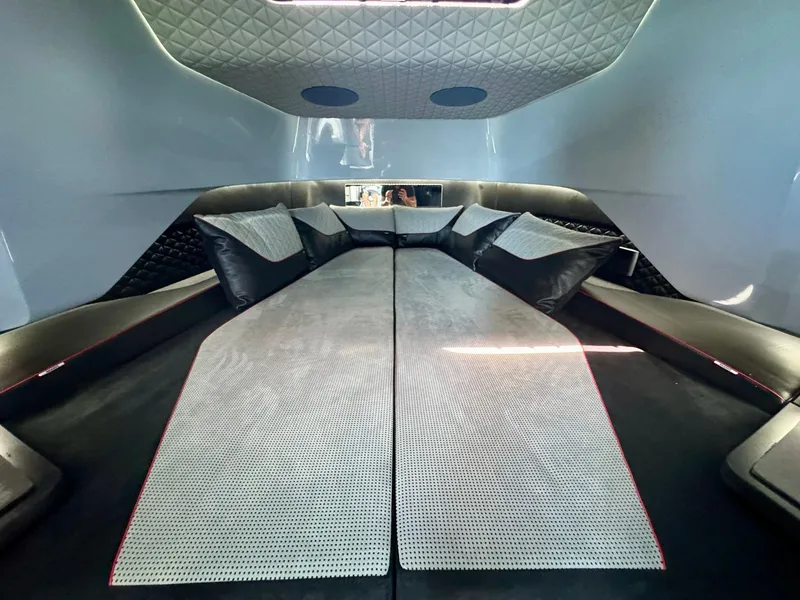 Slide: The Image of Luxurious interior cabin of 2023 Axopar Shadow 900XC with plush seating and modern design. - 40