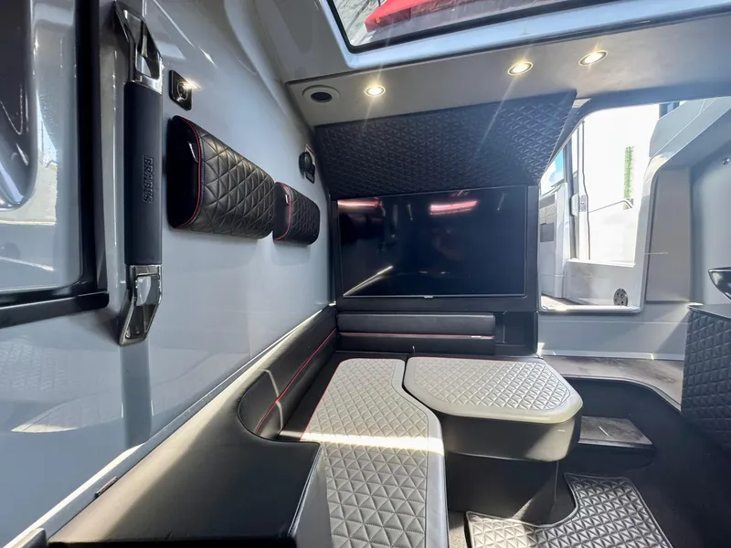 Slide: The Image of Luxurious interior of 2023 Axopar Shadow 900XC with quilted seating and modern design. - 41