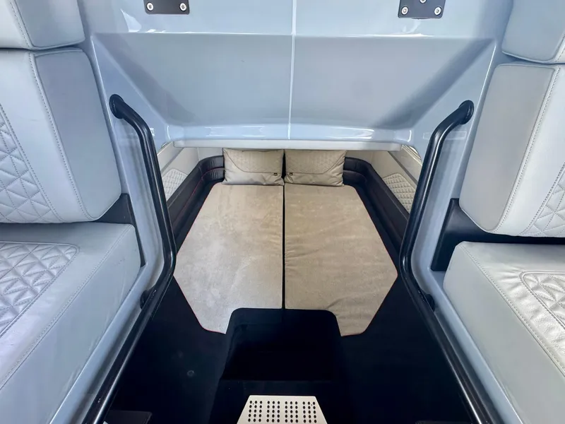 Slide: The Image of 2023 Axopar Shadow 900XC interior cabin with cushioned seating and modern design. - 43