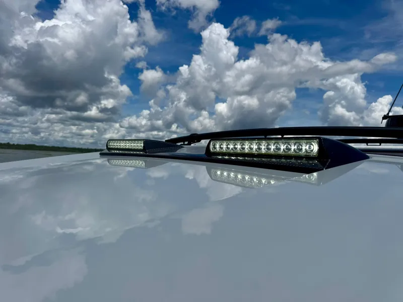 Slide: The Image of 2023 Axopar Shadow 900XC LED lights under a cloudy sky. - 49