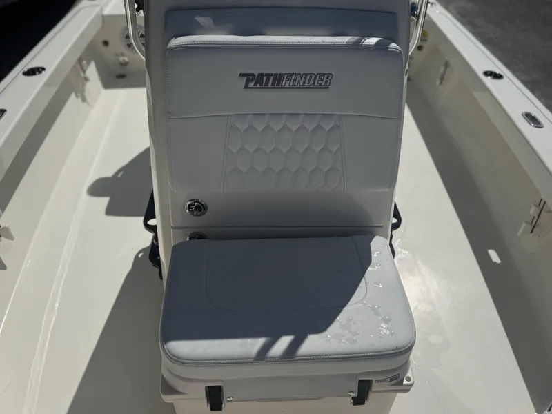Slide: The Image of 2025 Pathfinder 2200 TRS boat seat with logo, featuring white upholstery and modern design. - 10
