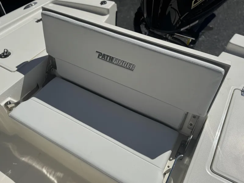 Slide: The Image of 2025 Pathfinder 2200 TRS boat seat with logo, featuring white upholstery and sleek design. - 11