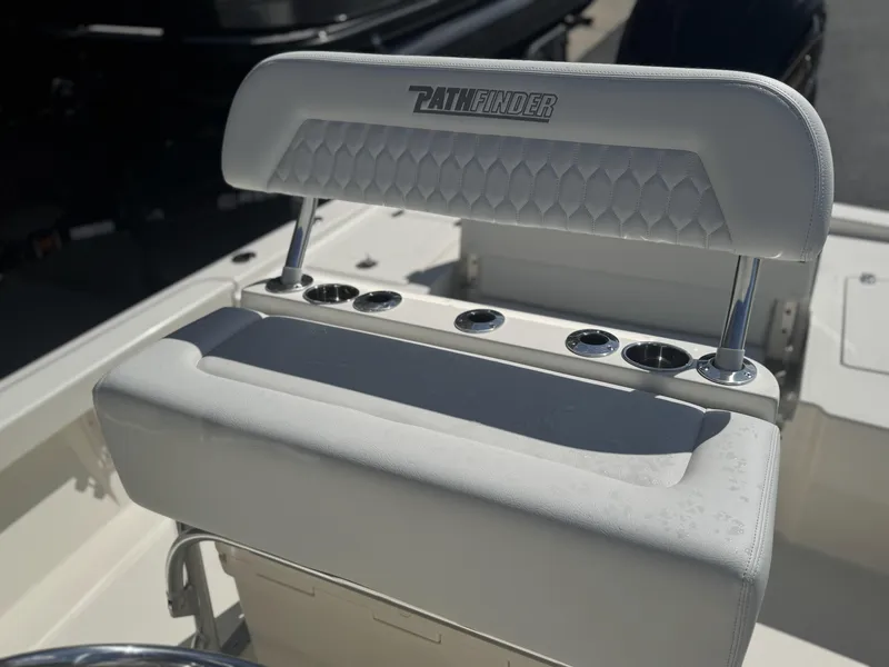 Slide: The Image of 2025 Pathfinder 2200 TRS boat seat with cup holders and logo detail. - 13