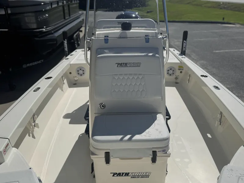 Slide: The Image of 2025 Pathfinder 2200 TRS boat interior with seating and console. - 14