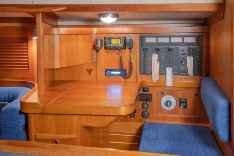 Slide: The Image of Navigation station with control panel in 2000 Sabre 402 sailboat interior. - 7
