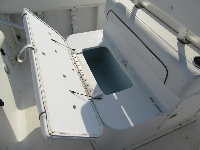 Slide: The Image of Open storage compartment on 2014 Sea Hunt Ultra 234 boat. - 10