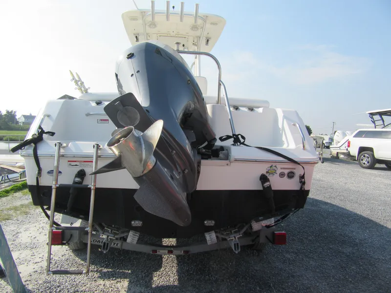 Slide: The Image of 2014 Sea Hunt Ultra 234 boat with outboard motor, rear view. - 11
