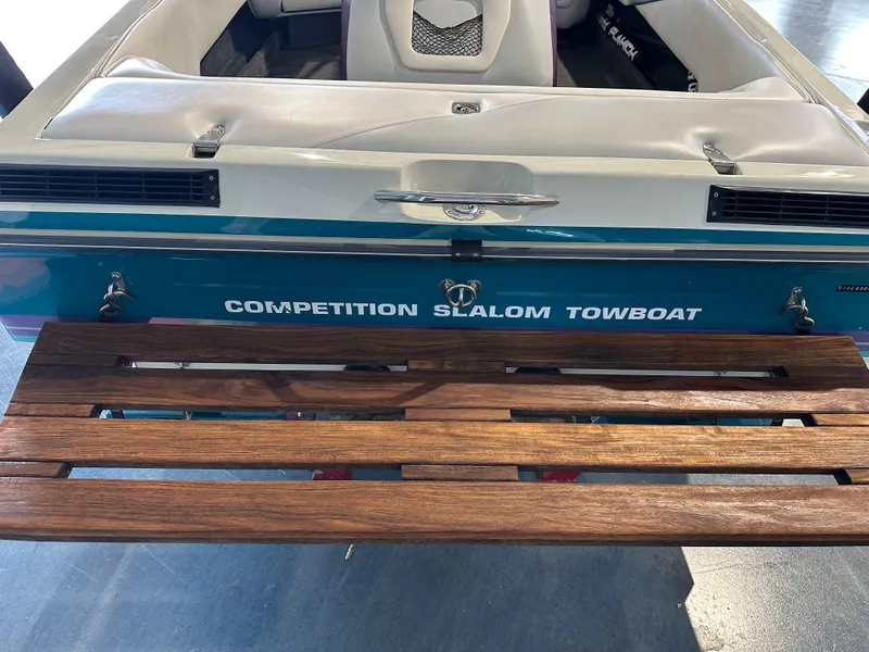 Slide: The Image of 1995 Tigé 2002 FSLM COMP competition slalom towboat with wooden swim platform. - 5