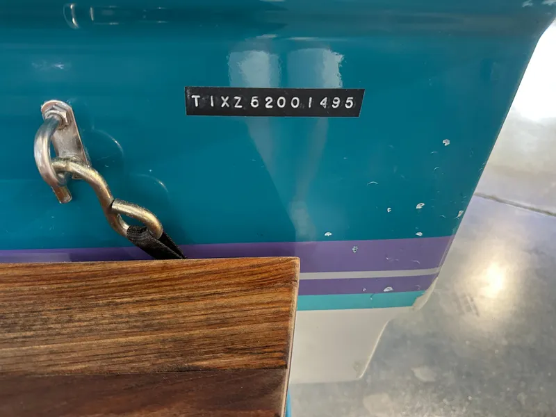 Slide: The Image of 1995 Tigé 2002 FSLM COMP boat hull with serial number visible. - 6