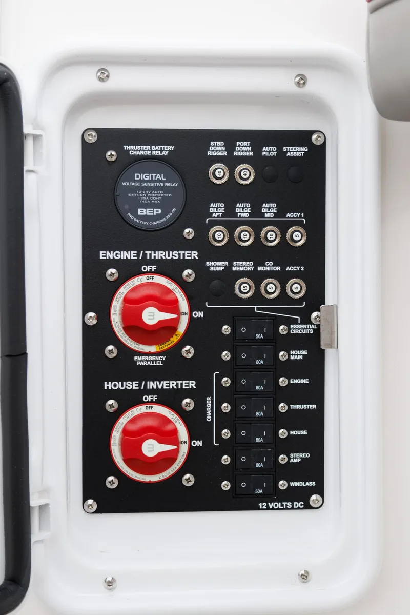 Slide: The Image of Control panel of 2026 Solara S-250 DC boat with switches and dials. - 13