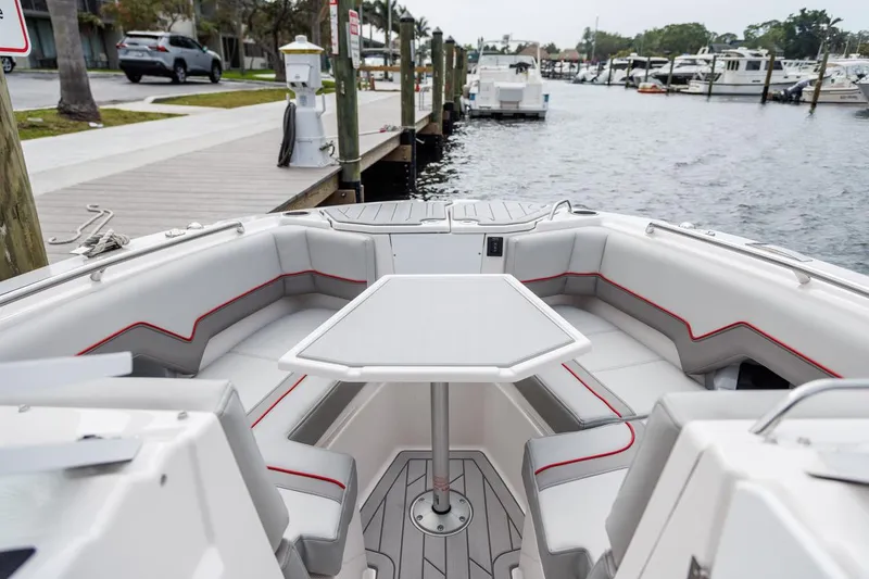 Slide: The Image of Modern 2026 Solara S-250 DC boat interior with seating and table, docked at marina. - 15