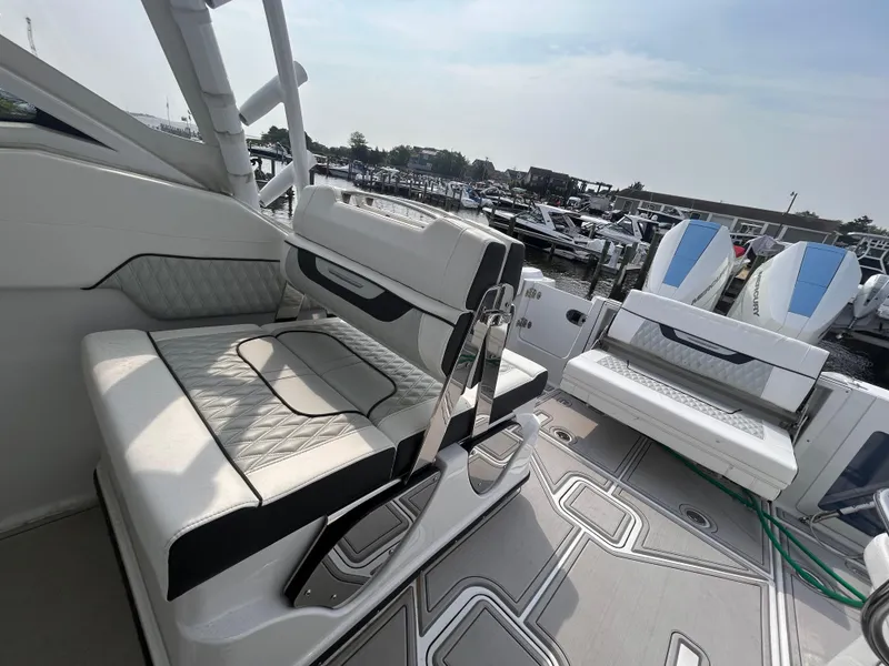 Slide: The Image of 2024 Blackfin 302DC boat interior with luxurious seating and modern design. - 11