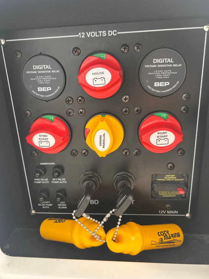 Slide: The Image of 2024 Blackfin 302DC control panel with digital voltage sensing relays and safety equipment. - 12